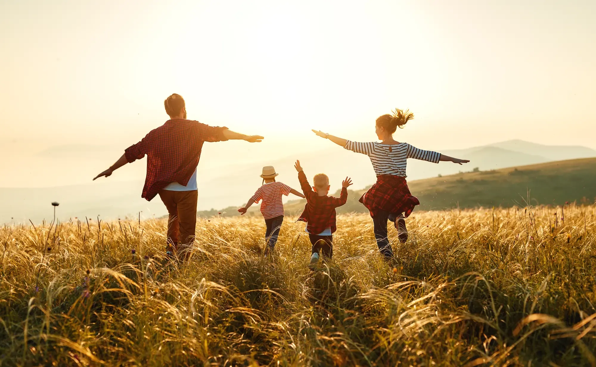 mother, father, children son and daughter on sunset